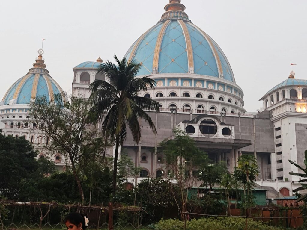 Stunning architectural view of a temple with blue domes in Mayapur, West Bengal.